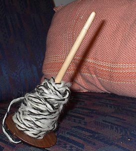 [2ply dark llama and white wool on drop spindle]